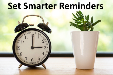 Photograph of an Alarm CLock and a plant with the words "Set Smarter Reminders"