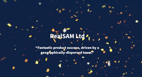 Real Sam are congrulated on winning team of the year at the Rising stars awards. Company name is displayed against a dark blue background with stars