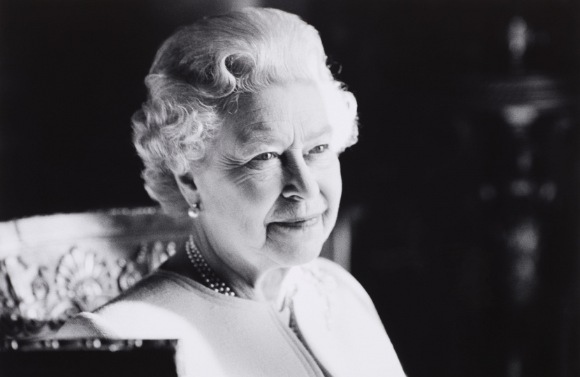 Black and white image of Her Majesty Queen Elizabeth smiling