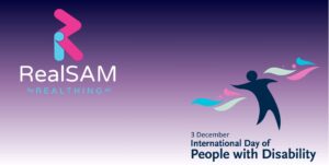 Gradient background with RealSAM logo on the left. On the right, a silhouette dances amongst colourful shapes. The text accompanying the shapes reads "3 December International Day of People with Disability"