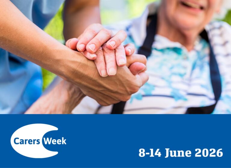 A Carers Week graphic showing a close-up of two pairs of hands — one younger, one older — clasped together warmly. The older person is seated in a wheelchair. It is a depiction of caring for someone with sight loss. Below, a royal blue banner displays the official Carers Week logo alongside the text "8–14 June 2026" in white.
